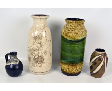 Three variously glazed West German ceramic vases, the tallest height 42cm, and a small baluster example with handle (4).