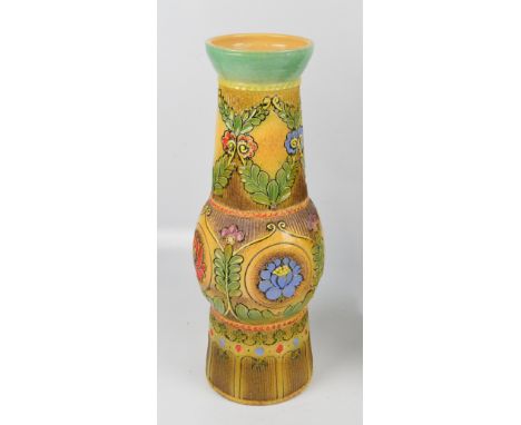 A large Hungarian studio ceramic vase of tapering form with globular central section, incised and overpainted floral and foli