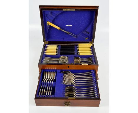 A mahogany cased canteen of electroplated ivorine handled cutlery including a pair of carving tools, the case with ivory inse