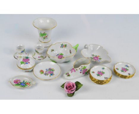 A group of various Herend porcelain items to include a leaf shaped dish, a floral ornament, a set of twelve circular pin dish