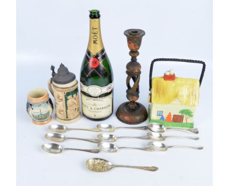 A mixed lot including a ceramic cottage biscuit barrel, a pewter lidded stein, and an empty bottle of Moët Chandon champagne 