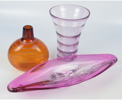 A Belgian Val St. Lambert clear and cranberry glass navette shaped bowl, length 54cm, also a purple tinted ribbed flared vase