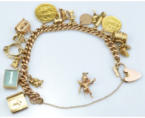 A 9ct yellow gold curb link charm bracelet with padlock clasp, length 17cm, suspending several 9ct yellow gold charms includi