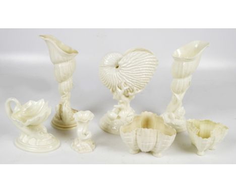 A small quantity of Royal Worcester including a pair of shell form vases, a clam shell bowl supported on a dolphin and a naut
