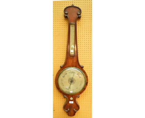A late 19th century aneroid mahogany cased barometer and mercury thermometer inscribed "T. Saunders, Dorchester", height 104c