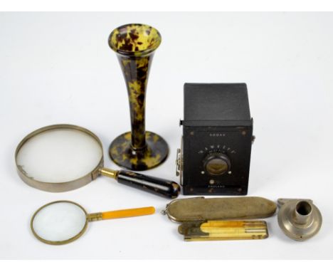 A 1920s/30s plastic stethoscope, length 14cm, a Kodak Hawkeye no.127 camera, two magnifying glasses, a model C reproducer pho