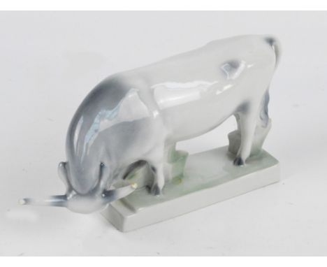 A Zsolnay Pecs ceramic figure of bison on rectangular naturalistic base, mark to underneath, length 30cm (af).    CONDITION R