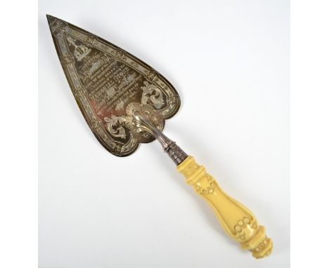 WILLIAM HUTTON AND SONS; a Victorian hallmarked silver ivorine handled presentation trowel engraved with foliate scroll and o