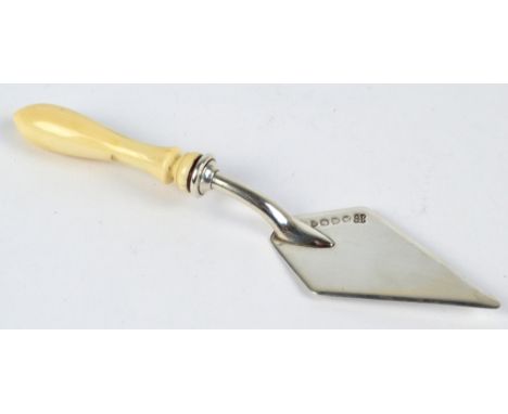 HUKIN & HEATH; a Victorian hallmarked silver cheese server modelled as a trowel with turned ivory handle, London 1881, length