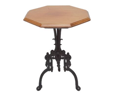 A mahogany octagonal occasional table on cast iron scroll decorated tripod base, height 70.5cm.