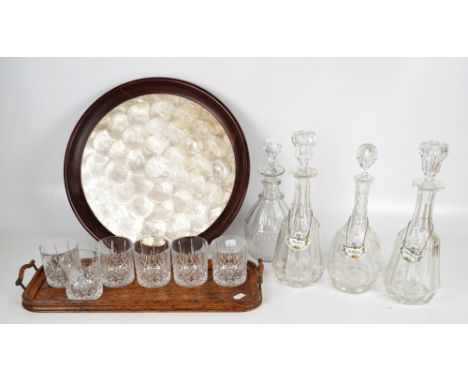 A pair of clear cut glass faceted decanters with bell shaped stoppers, height 33.5cm, two further decanters, three ceramic la