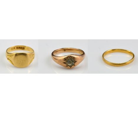 A 22ct yellow gold wedding band, size Q, an 18ct gold gentleman's signet ring with traces of initials to the top, size R, and