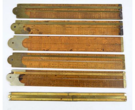 Four similar boxwood, brass and nickel mounted hinged slide rules, with engineer delineations by Routledge, the rules themsel