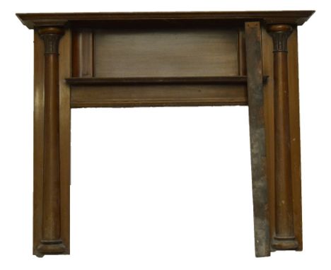 A mahogany fire surround with secondary mantel shelf, flanked by column mouldings, length 161cm, external height 130cm, inter