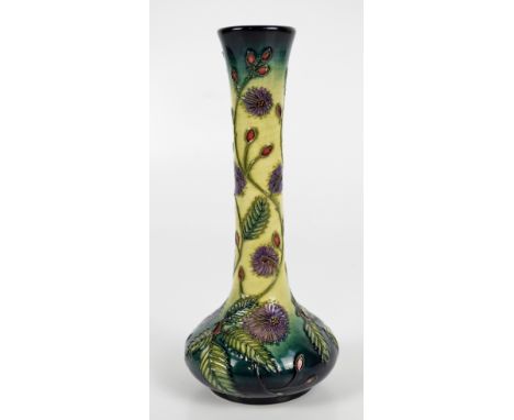 MOORCROFT; a modern floral pattern tube line decorated vase with squat body and slender neck, impressed marks and initial sig