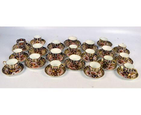 A large collection of Royal Crown Derby Imari decorated cabinet cups and saucers including a set of six circular shaped examp