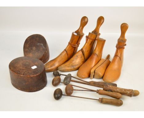 A collection of milliners' tools, two hat locks and four wooden shoe lasts.