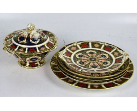 A group of Royal Crown Derby Imari pattern decorated plates, the largest diameter 26.5cm and a footed twin handled sauce boat