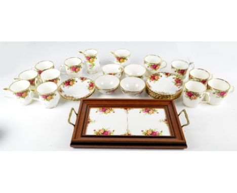 A quantity of Royal Albert "Old Country Roses" including six mugs, large teacups and saucers, sugar bowls and carrying tray.
