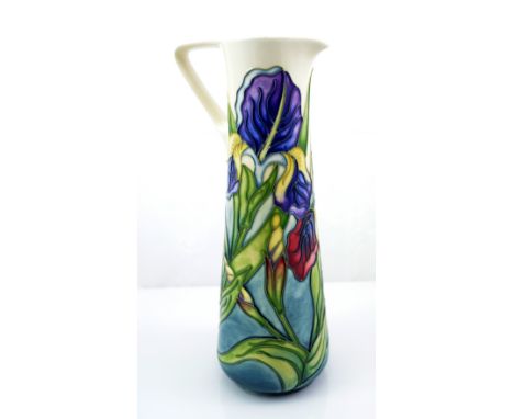 MOORCROFT; a modern Collectors' Club "Iris" pattern tube line decorated pitcher of tapering form, on cream and light blue gro