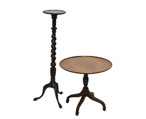 An oak plant stand with barleytwist pedestal leading to tripod legs with pad feet, with a mahogany circular pedestal coffee t