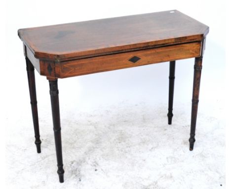 A late George III mahogany, crossbanded and chevron strung card table, raised on ring turned tapering legs, width 94cm.