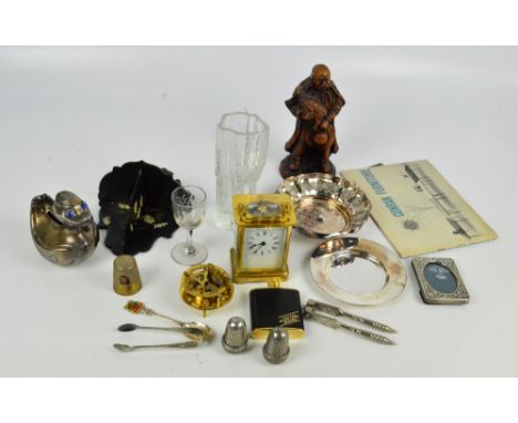 A mixed collectors' lot including a carriage clock, acorn cruet, pewter duck money bank, small folding shelves, resin figure,