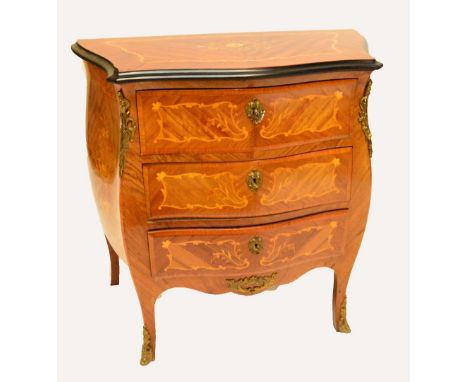 A reproduction inlaid French style three drawer commode of bombé outline, width 80cm.