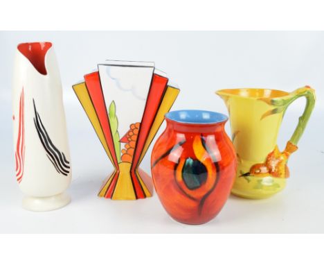 A Poole Pottery baluster vase, height 16.5cm, a Burleigh abstract motif decorated tapering vase, and a jug with moulded bird 