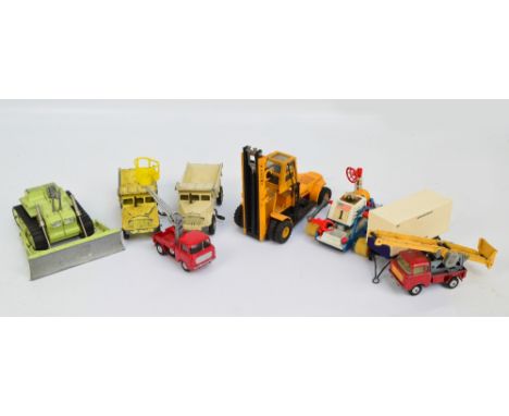 A Corgi diecast Euclid TC-12 tractor, unboxed, a Dinky Euclid rear dump truck, unboxed, and six further unboxed Corgi and Din