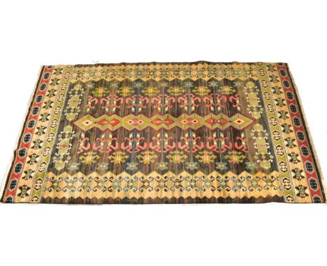 A 20th century Afghan Islamic Kilim floor carpet rug. The rug having a central forest green panel with repeating geometric pa