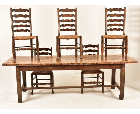 A large Victorian 19th century fruitwood refectory farmhouse dining table together with set of five ladder backs chairs. The 