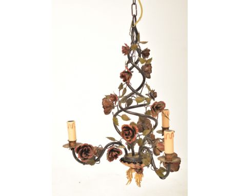 An Italian inspired three arm cage toleware chandelier ceiling light. The light having a twin spiral body decorated with rose