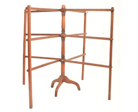 A Victorian 19th century floor standing expanding clothes line stand. Mahogany tripod leg base with upright column having a m