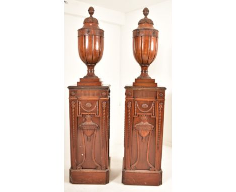 A large pair of Adams Revival mahogany decorative pedestals columns stands in a Neo-Classical manner. Each column having a fi