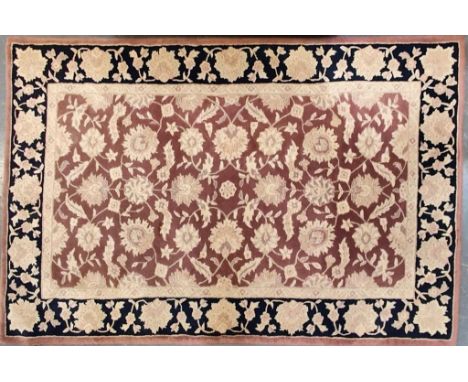 A 20th century Persian Afghan floor carpet rug. The rug having a central red panel with cream floral decoration enclosed with