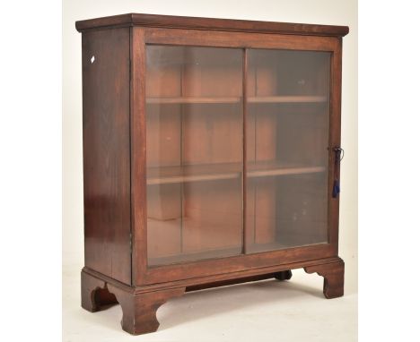 A George III early 19th century mahogany glazed floor-standing bookcase cabinet. The cabinet having a straight top over a gla