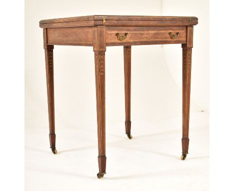 An Edwardian oak &amp; gilt detailed envelope card / game table. The table having a squared folding envelope top opening to r