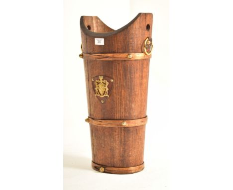 An early 20th century oak staved umbrella / stick stand bucket. The stand having a concave mouth with twin ring handles to ea