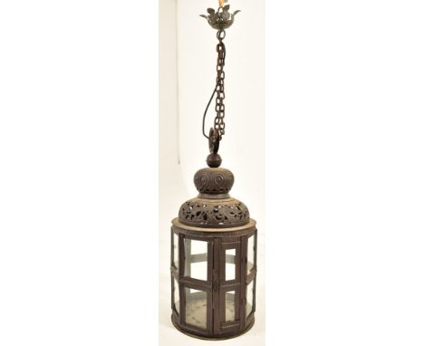 A Moroccan inspired octagonal pierced metal &amp; glazed ceiling lantern light. The lantern having ring hook atop over a bulb