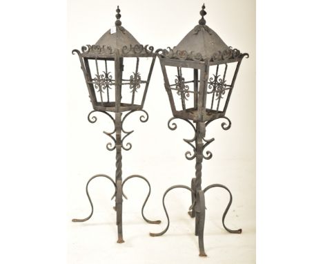 A pair of late 19th century painted wrought iron castle / stately home wall corner pedestal lantern lights. Each having a sha