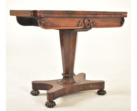 A William IV 19th century rosewood card / games table. Raised on a quatrefoil base with bun feet. Tapering octagonal column r