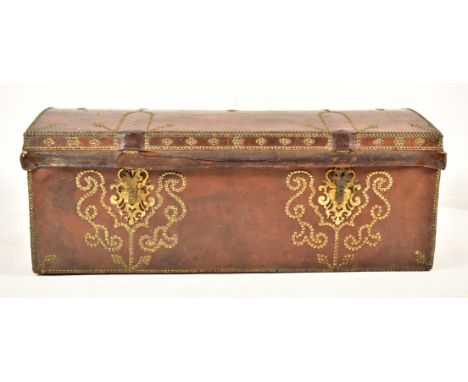 A George III late 18th century brass &amp; leather studded dome top travelling trunk chest. The trunk in brown leather with g