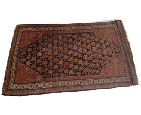 A 19th century hand woven Persian Islamic Bidjar floor carpet rug. The rug having a central shaped medallion with series of r