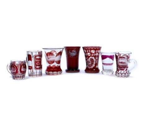 Three Bohemian glass tankards 19th century each ruby flashed and engraved, together with four goblets of a similar style. (7)