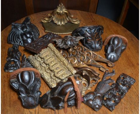 A collection of giltwood architectural mounts brackets and other related pieces