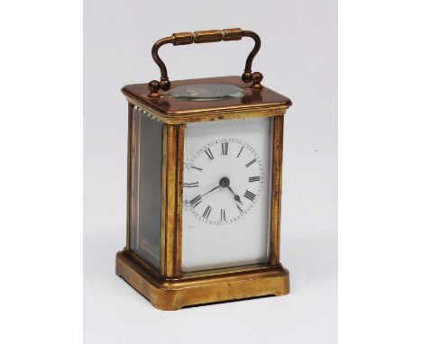 A 19th Century brass carriage clock with loop handle and enamel dial