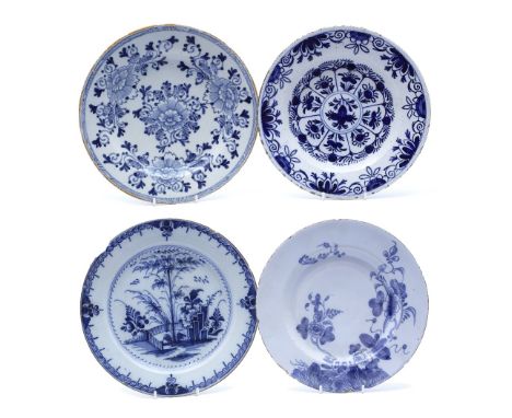 A collection of four Delft and Delftware blue and white plates 18th Century variously decorated, largest 23.5cm,two Dutch,one
