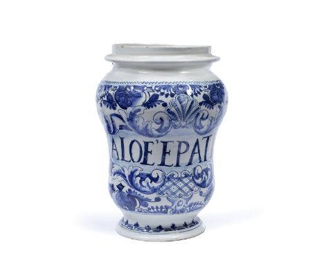 An Italian pottery albarello, probably French (Montpellier?) Early 18th Century inscribed Aloe' Epatico within a scroll and s
