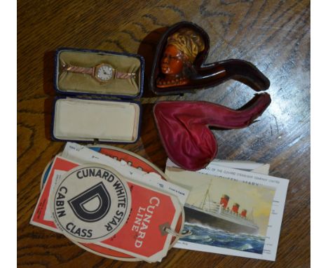 A ladies 9ct gold wrist watch together with a carved pipe in the form of a lady's head in original leather case and a small c
